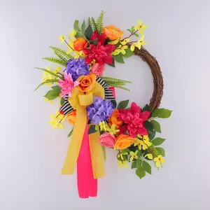 Vibrant spring floral wreath with colorful flowers and ribbons for front door decor