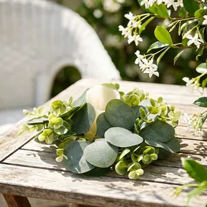 Elegant eucalyptus leaf wreath candle holder with white pillar candle for spring table decor