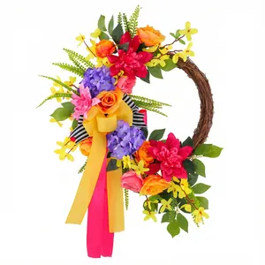 Vibrant spring floral wreath with colorful flowers and ribbons for front door decor