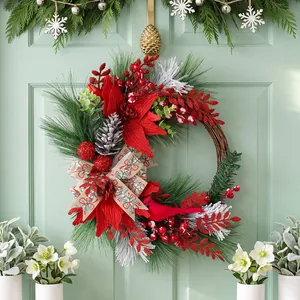 Festive Christmas wreath featuring pine branches red berries and a cardinal on a green door
