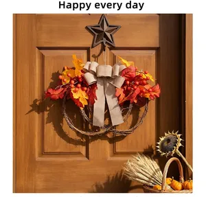 Atmospheric view of autumn maple leaf wreath with red berries on a wooden door