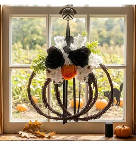 Detail of Halloween pumpkin floral wreath featuring black and orange silk roses