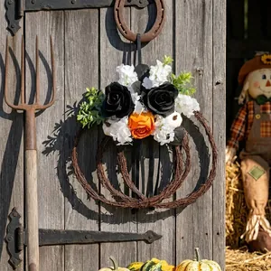 Rustic Halloween pumpkin twig wreath with black and orange roses for garden decor.