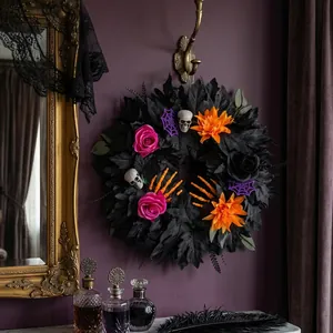 Gothic Halloween wreath with black leaves, pink roses, and skulls for home decor
