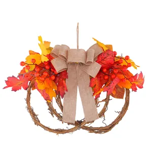 Pumpkin shaped vine wreath with autumn maple leaves berries and burlap bow for Thanksgiving