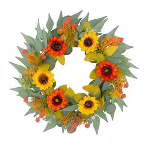 Vibrant autumn sunflower wreath with green leaves and orange berries for door decor