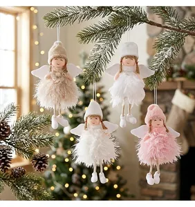 Close-up view of cute plush Christmas angel ornaments with soft feather skirts