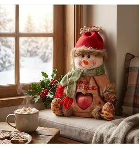 Sacco di mele natalizio pupazzo di neve esposto su un davanzale con dolci festivi
