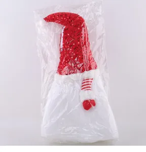 Rote Paillettenmütze Weihnachtsgnom-Puppe in einer transparenten Schutzverpackung