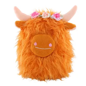 Simpatico peluche mucca Highland arancione con corona di fiori e lunga pelliccia