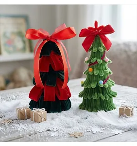 Close-up of handmade velvet pipe cleaner Christmas trees with festive red bows