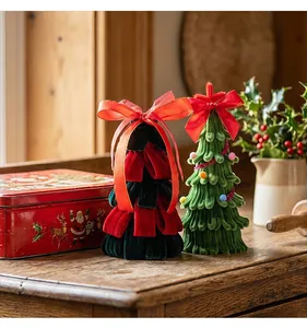 Detailed macro view of DIY velvet miniature Christmas trees set on a rustic wooden table