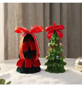 Close-up detail of handmade velvet and pipe cleaner Christmas tree desktop ornaments