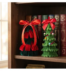 Detailed view of handmade mini pipe cleaner Christmas trees on a wooden bookshelf