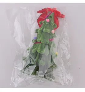 Miniature green chenille stem Christmas tree craft with red bow in plastic packaging