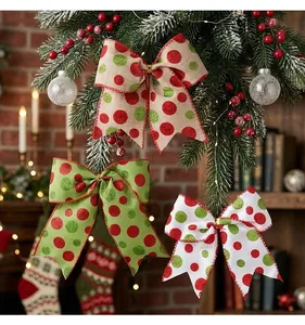 Festive red and green polka dot Christmas bows hanging as tree decorations for holidays