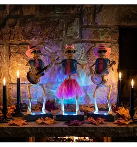 Halloween musical skeleton band with glowing LED lights in a stone fireplace setting.