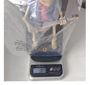 Halloween electric skeleton band ornament weighing 389g on a precision digital scale