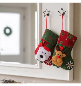 Detail view of festive Christmas stockings with cute polar bear and reindeer 3D designs