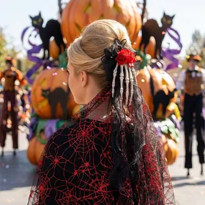 Gothic Halloween hair clip with red rose, skeleton hand and spiderweb mesh veil