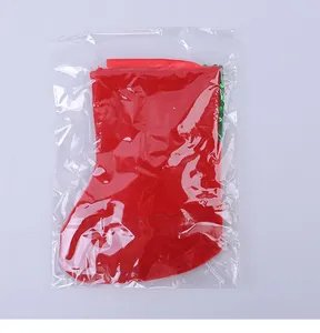 Red Christmas stocking gift bag in clear protective plastic packaging