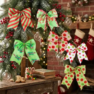 Festive red and green Christmas bows with stripes and polka dots hanging on a pine branch.