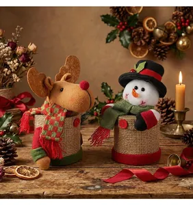 Handmade rustic Christmas candy jars featuring plush reindeer and snowman character details.