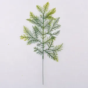Detailed close-up view showing the back structure of an artificial green pine needle branch