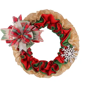 Rustic Christmas burlap wreath with red and green ruffles, plaid bow and snowflake