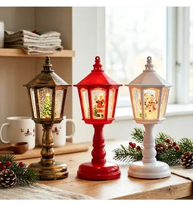 Set of three vintage Christmas lanterns with Santa and snowman scenes in glowing globes.