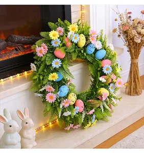 Detailed view of an Easter wreath with speckled eggs and spring flowers on a mantel