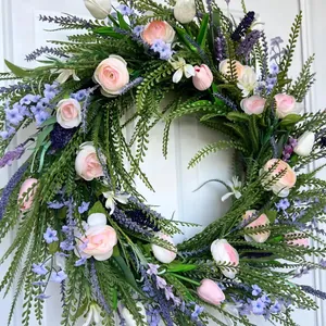 Close-up detail of a lush spring floral wreath featuring pink roses and purple lavender.