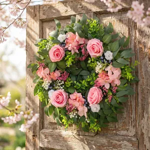 Artificial pink rose and hydrangea wreath for spring door decor and Easter ambiance.