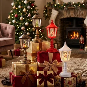 Set of vintage Christmas streetlamp snow globes on festive gift boxes in a warm room