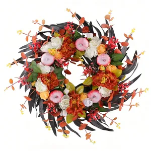 Vibrant autumn wreath featuring black leaves, orange peonies and pink pumpkins decor