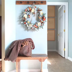 Beautiful artificial autumn acorn wreath with natural textures for cozy seasonal home decor