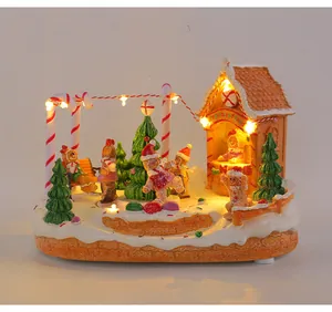 Lit-up Christmas musical box with rotating gingerbread men and pine tree
