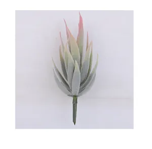 Primer plano de una planta suculenta artificial con hojas verdes y puntas rosas
