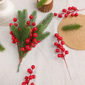 Realistic Christmas artificial pine and red berry branch for festive home tabletop decor.