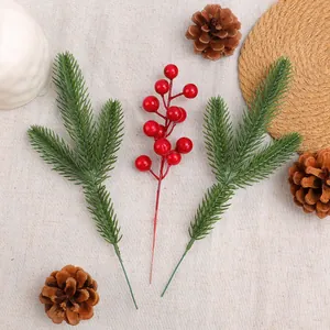 Artificial pine needles and red berry stems for Christmas table decor arrangements centerpiece.