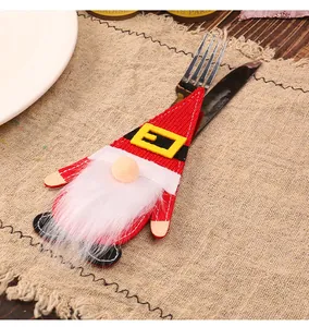 Christmas gnome felt cutlery holder with fork and knife on a rustic table mat