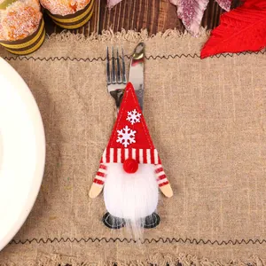 Christmas gnome cutlery holder made of red and white felt for festive table decoration
