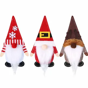 Three cute Christmas gnome cutlery holders made of felt for festive dinner table decor