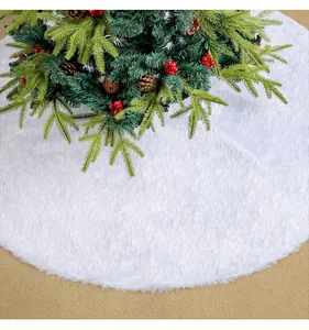 Close-up view of a premium white plush Christmas tree skirt with soft faux fur texture