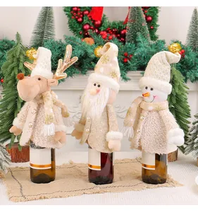 Set of three festive plush Christmas wine bottle covers featuring Santa, Snowman, and Reindeer.