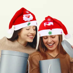Deux bonnets de Noël rouges festifs avec lumières LED pour les fêtes de famille