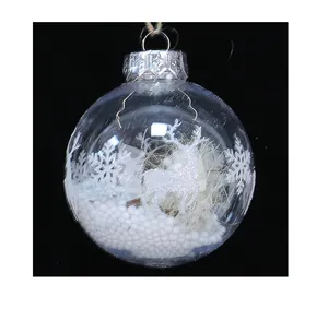 Detailed macro view of a transparent Christmas ball featuring a white reindeer design