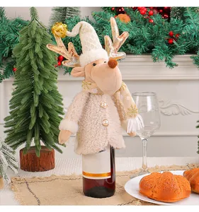 Cute plush reindeer wine bottle cover with gold antlers for festive Christmas dining table decor