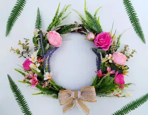 Decorative artificial rose wreath with a burlap lace bow for wedding and home wall hanging