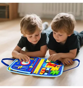 Close-up of children playing with a colorful felt busy board educational Montessori toy set